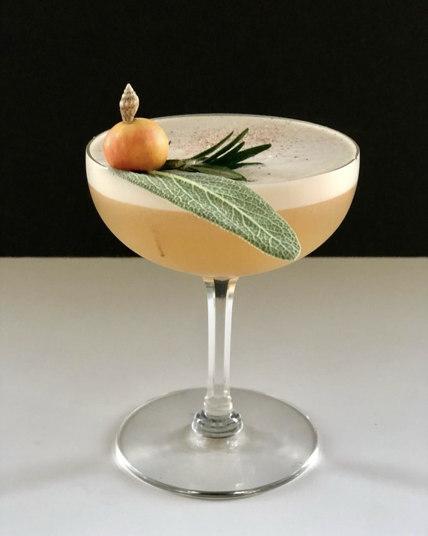 Amaro sour with sage leaf and rosemary
