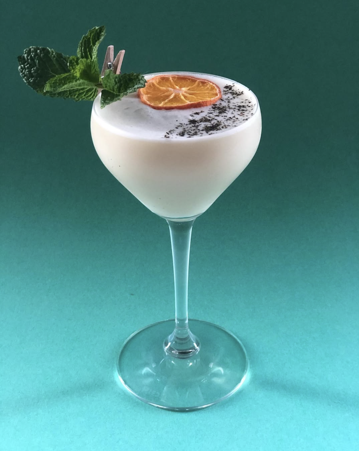 Creamy coupe with dried orange and mint